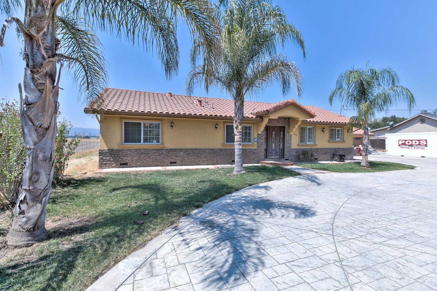 10415 New Avenue Gilroy, CA 95020 - Photo 2 of 55 a front view of a house with garden