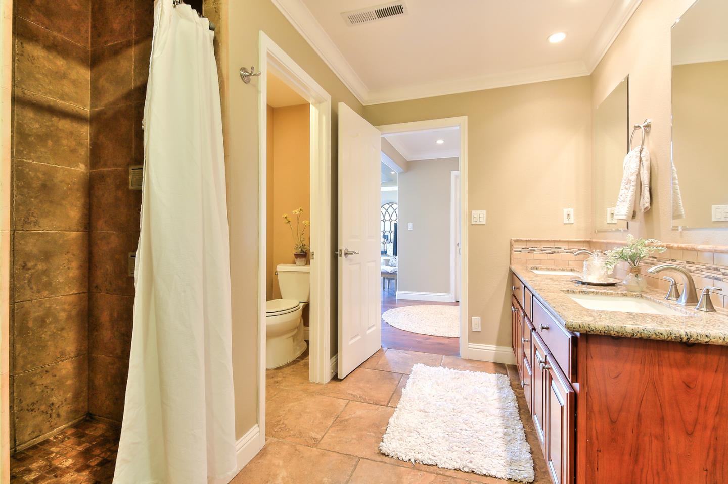 10415 New Avenue Gilroy, CA 95020 - Photo 21 of 55 a spacious bathroom with a sink a mirror and a shower
