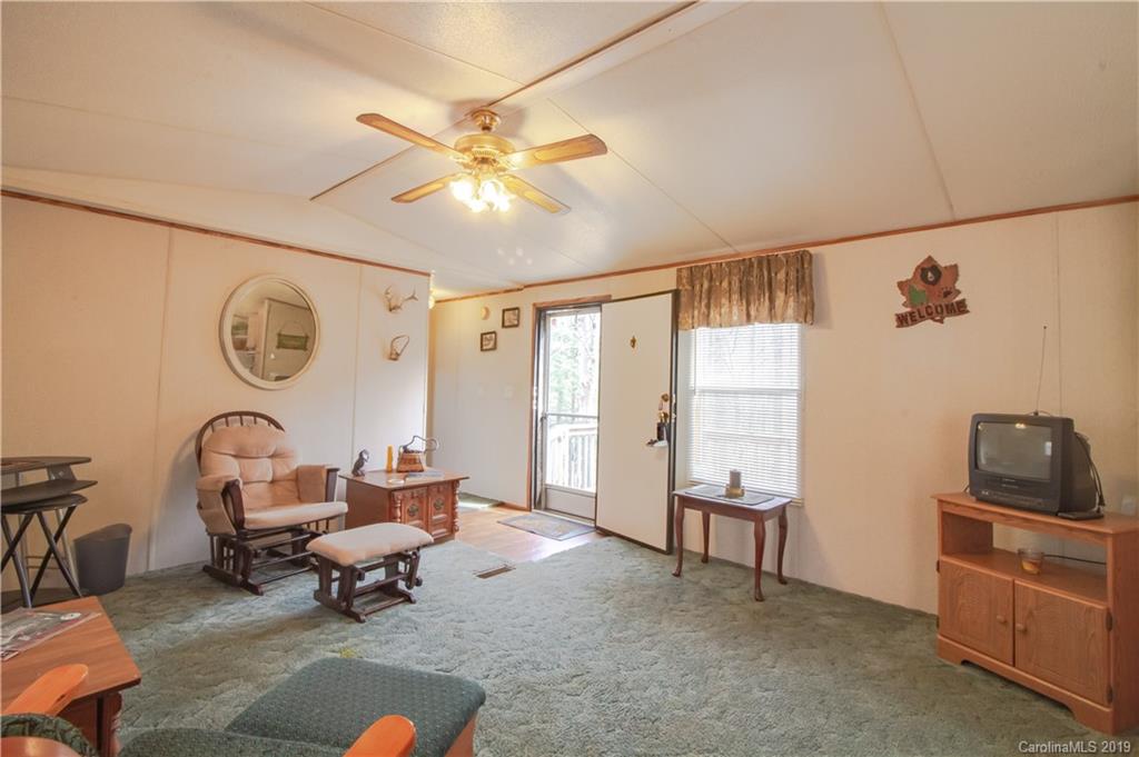 759 Girls Scout Camp Road Mill Spring, NC 28756 - Photo 8 of 23 a living room with furniture and a window