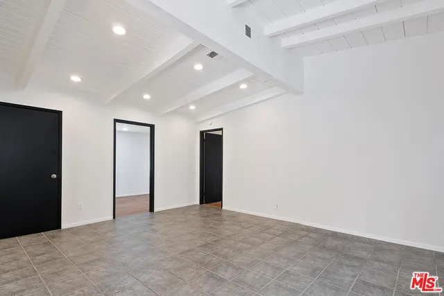 a kitchen with sink a faucet and cabinets