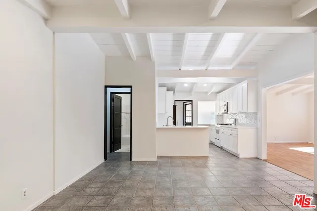 a kitchen with stainless steel appliances a refrigerator and a sink