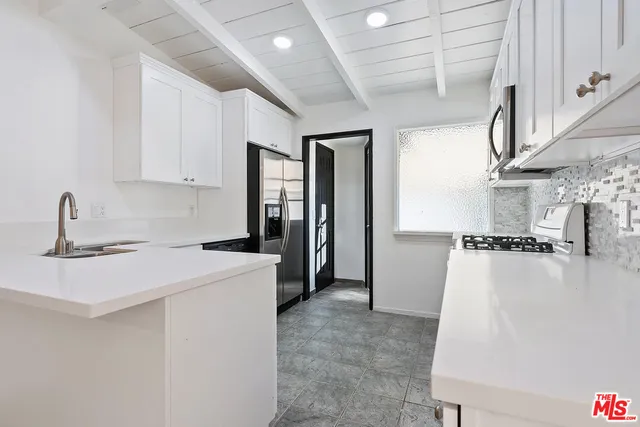 a bathroom with a sink a toilet and vanity