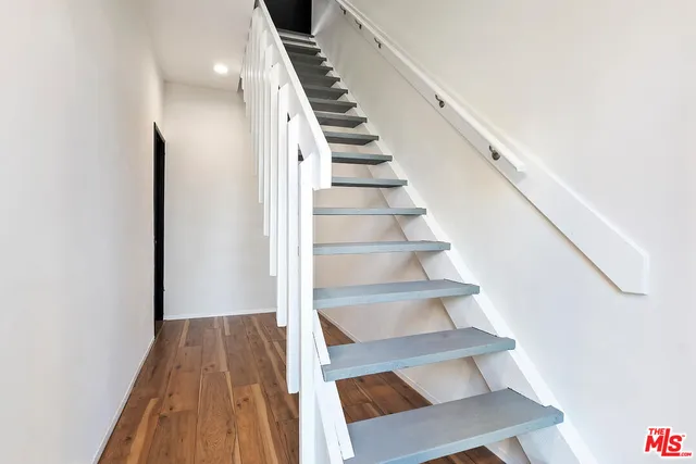 a kitchen with stainless steel appliances a refrigerator and a stove top oven