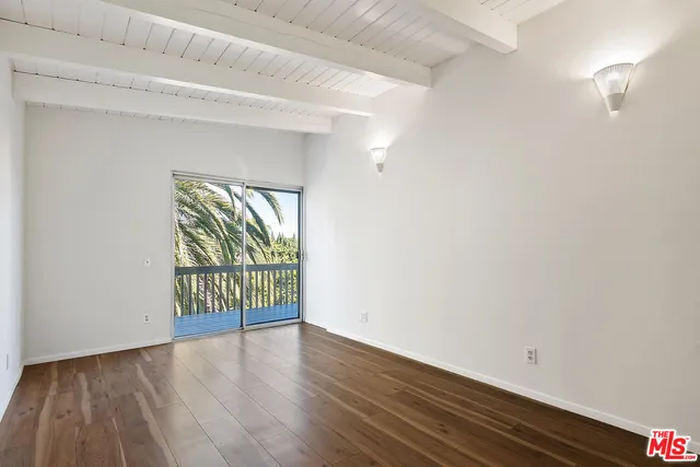a view of balcony with wooden floor