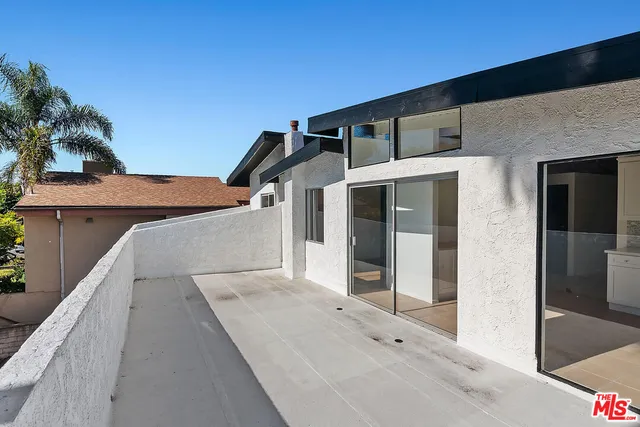 a picture of a bench in front of a wall