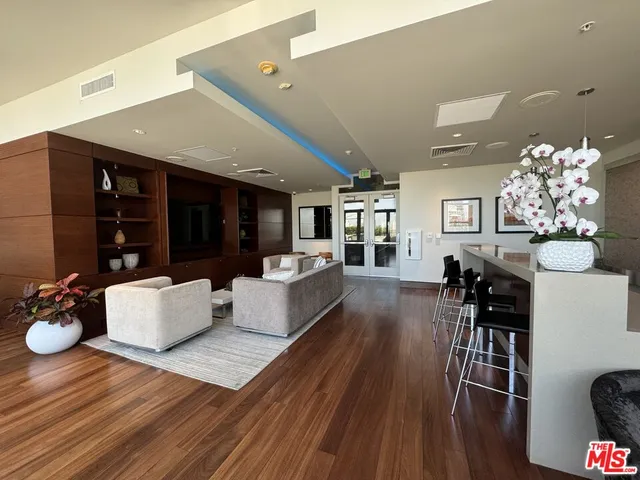 a view of a patio with chairs and plants