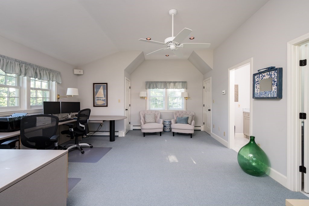 26 Talbot Road Hingham, MA 02043 - Photo 25 of 40 a living room with furniture and a chandelier