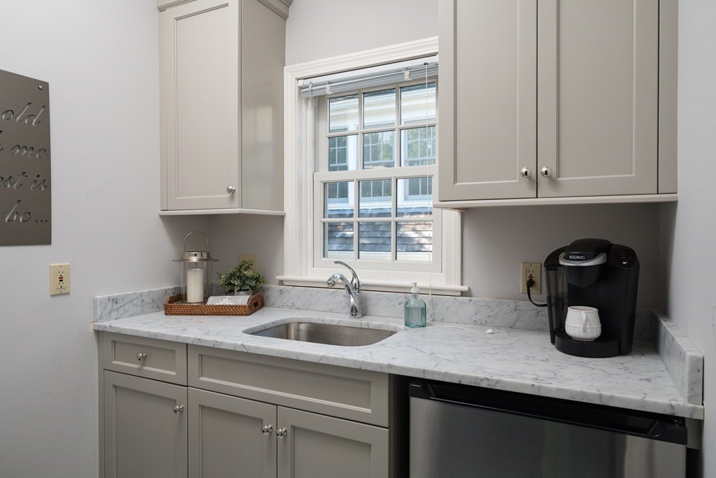 26 Talbot Road Hingham, MA 02043 - Photo 26 of 40 a kitchen with a sink and cabinets