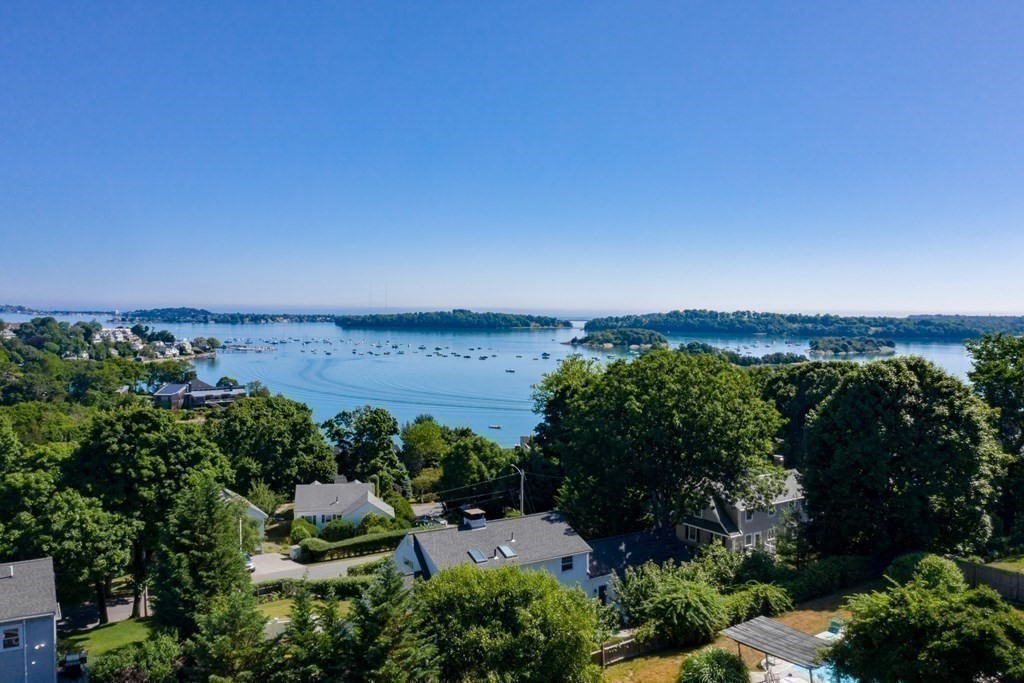 26 Talbot Road Hingham, MA 02043 - Photo 36 of 40 an aerial view of green landscape with trees houses and lake view