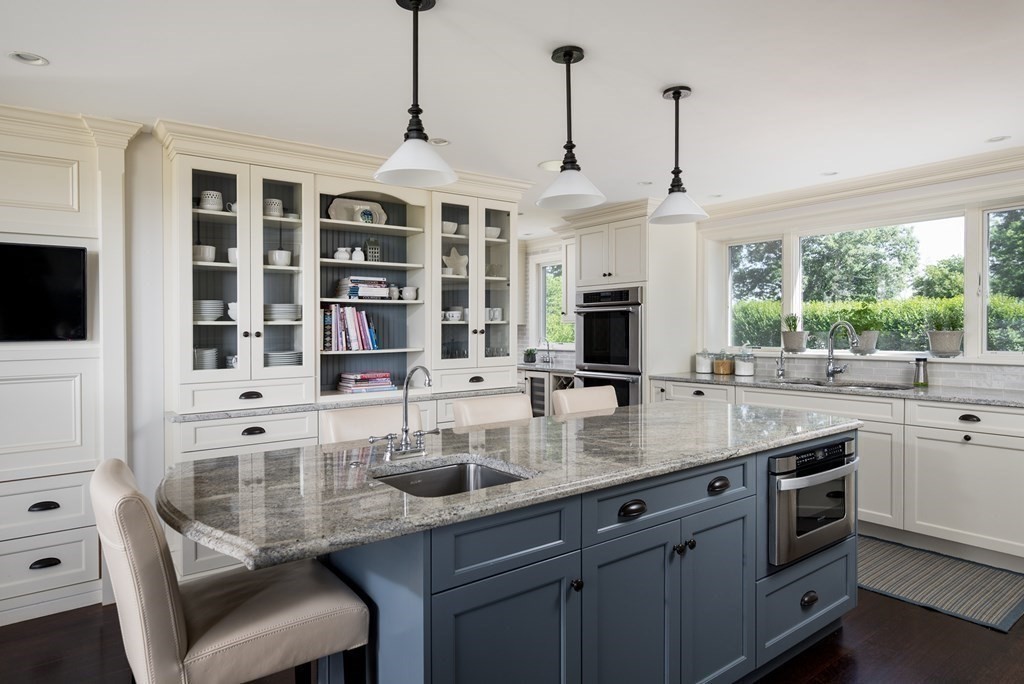 26 Talbot Road Hingham, MA 02043 - Photo 7 of 40 a kitchen with stainless steel appliances kitchen island granite countertop a sink and cabinets