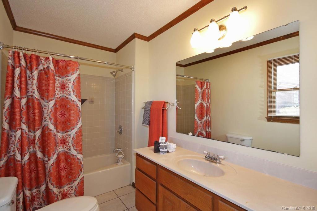 2095 Sides Road Salisbury, NC 28146 - Photo 17 of 25 a bathroom with a sink mirror vanity and toilet
