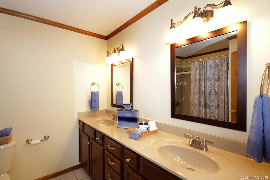 2095 Sides Road Salisbury, NC 28146 - Photo 19 of 25 a bathroom with a granite countertop sink and a mirror