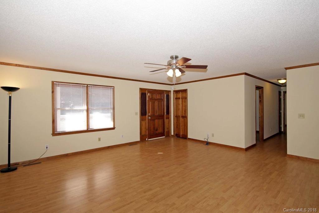 2095 Sides Road Salisbury, NC 28146 - Photo 5 of 25 wooden floor in an empty room with a window