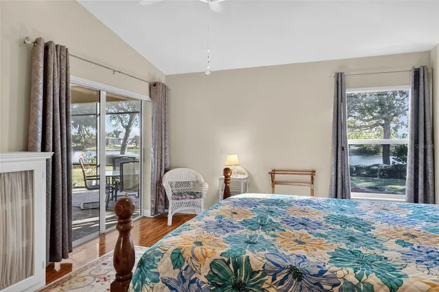 a bathroom with a granite countertop sink a large mirror and a bathtub with shower