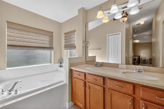 a bedroom with a bed and a desk