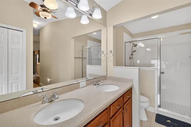 an empty room with closet and windows