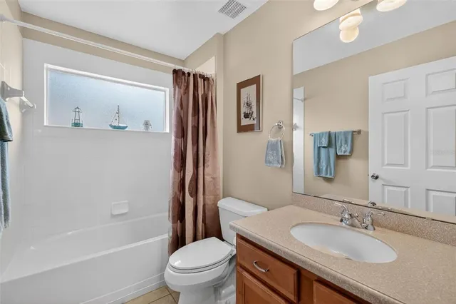 a view of a house with swimming pool and a yard