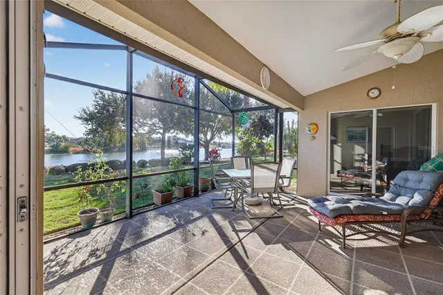 a view of a lake with houses in the back