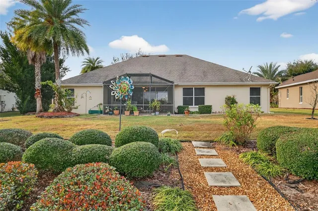 an aerial view of residential houses with outdoor space and swimming pool
