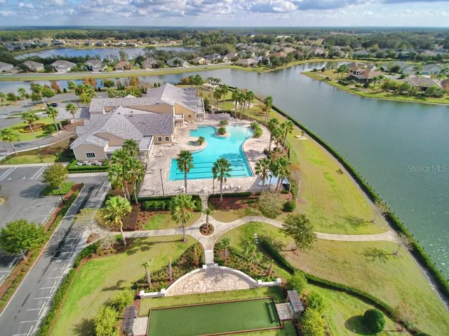 a dining room with furniture and chandelier