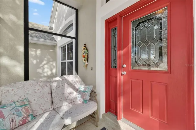 a living room with lots of furniture and view of kitchen