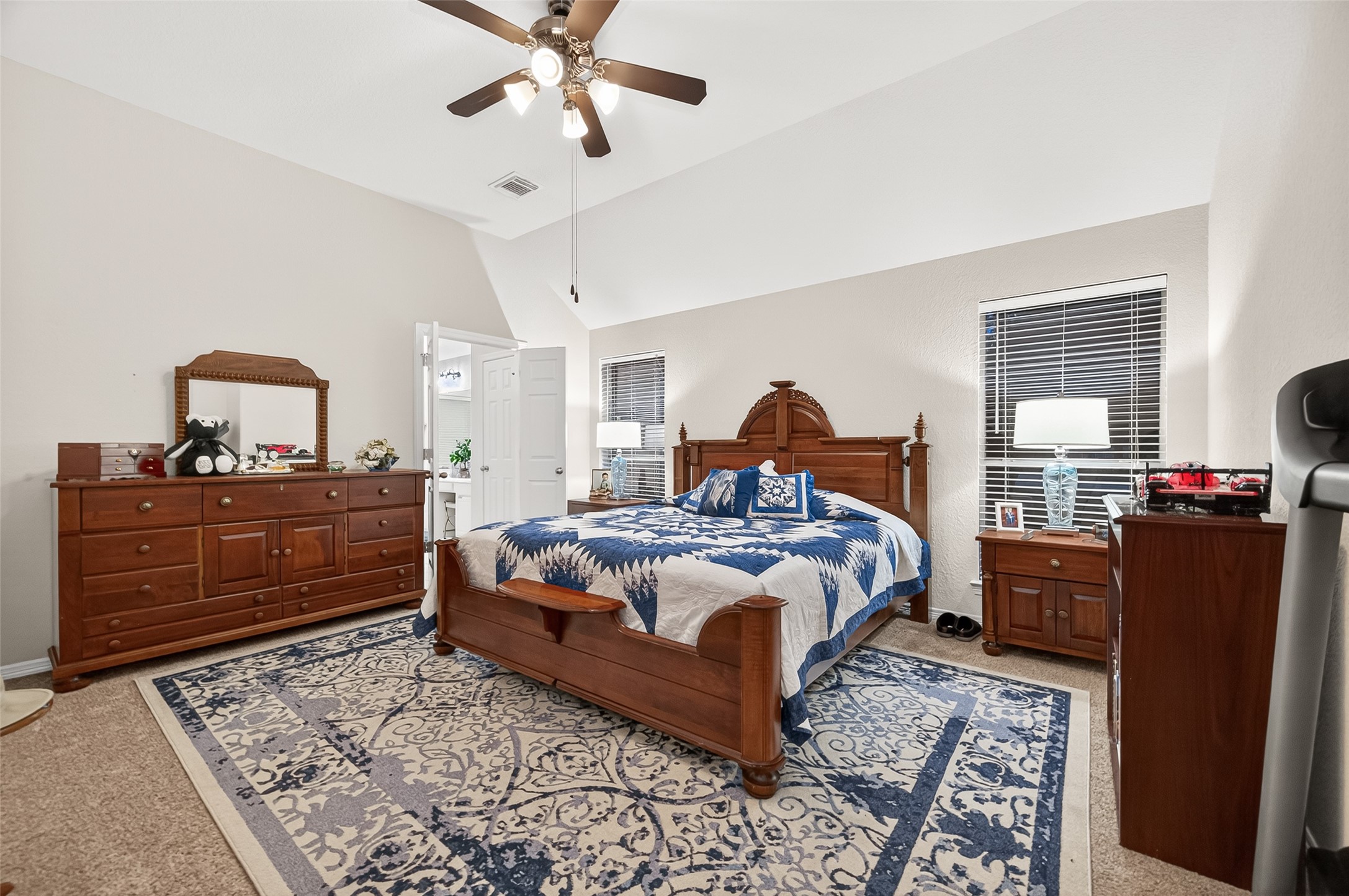 12455 West Summerlin Conroe, TX 77302 - Photo 18 of 31 a bedroom with a bed and wooden floor