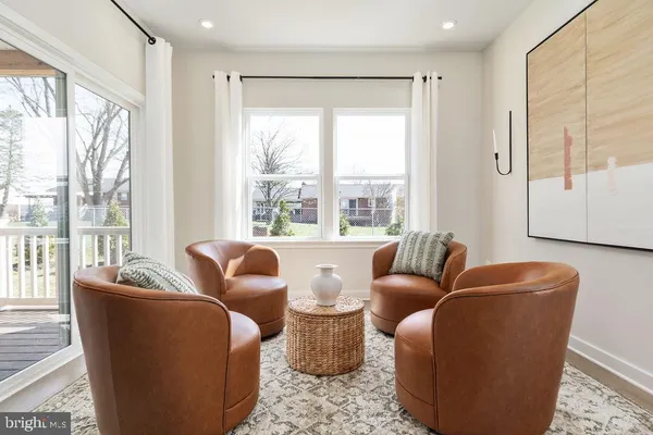 a living room with furniture and windows