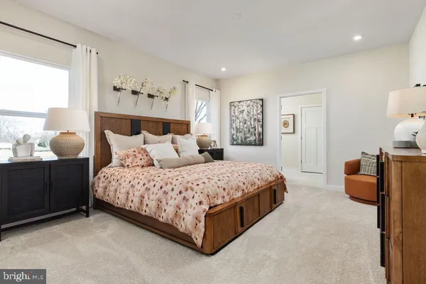 a bedroom with a bed and window