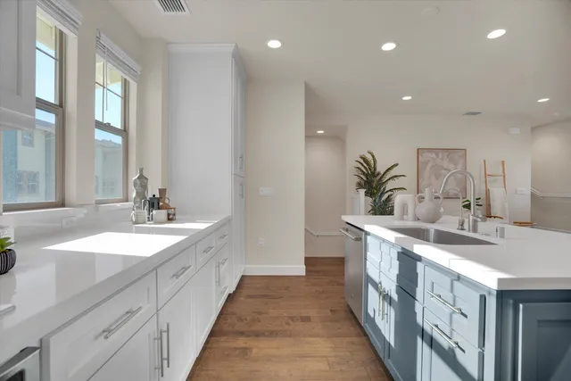a spacious bathroom with a double vanity sink and a mirror
