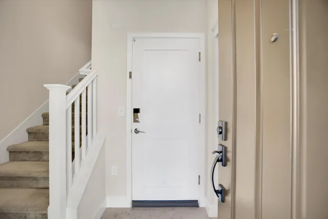 a view of front door with stairs
