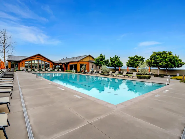 a view of swimming pool with chairs