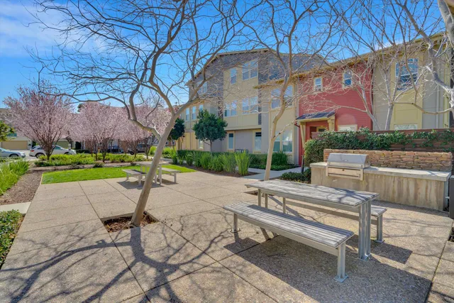 a white bench sitting in front of a building