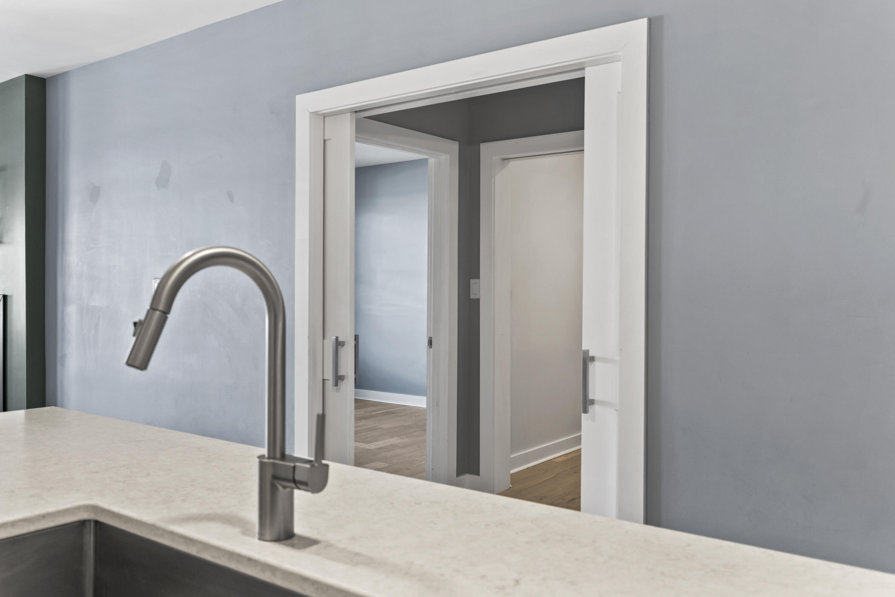 62 India Street, Unit 203 Portland, ME 04101 - Photo 28 of 70 Pocket Doors to Primary Bedroom Ensuite