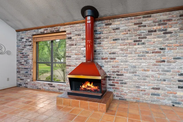 a front view of a fireplace with window