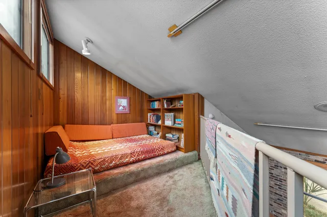 a bed room with a bed and furniture