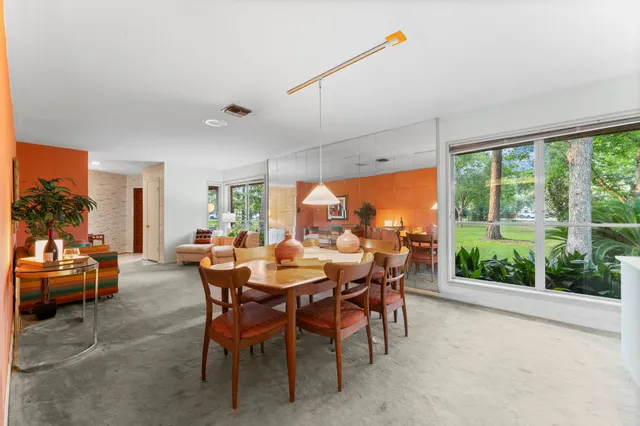 a view of a dining room with furniture window and outside view