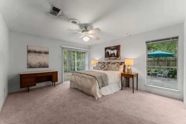 a bed room with a bed and a chandelier