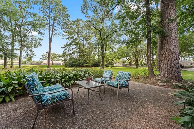 a view of a chairs and table in the garden