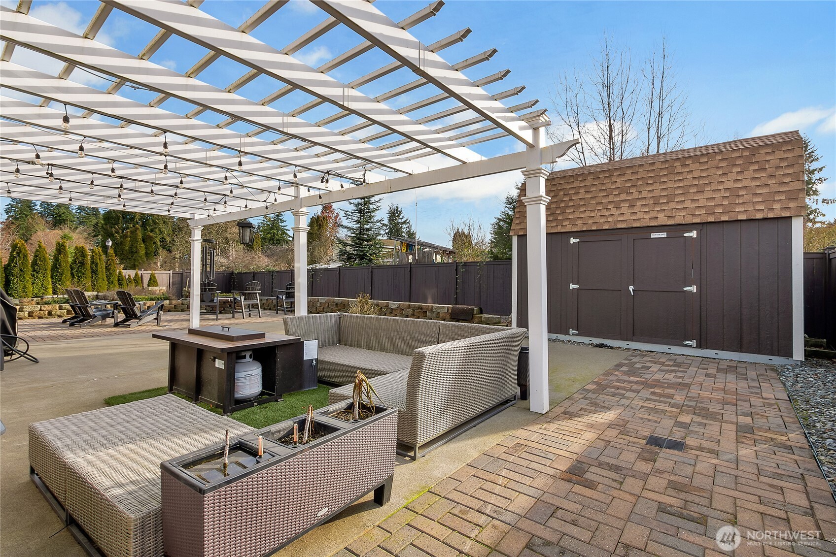 31524 11th Place Southwest Federal Way, WA 98023 - Photo 34 of 40 a view of a patio with a table and chairs and couches