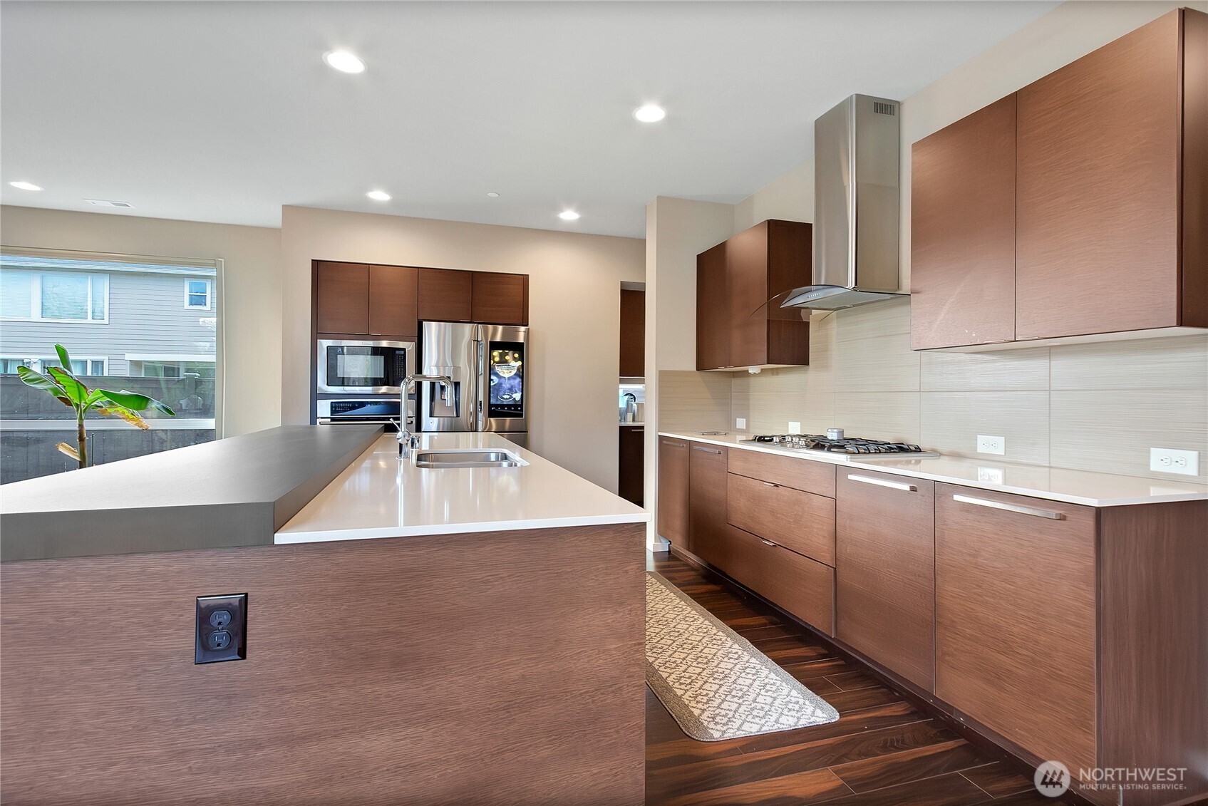 31524 11th Place Southwest Federal Way, WA 98023 - Photo 7 of 40 a kitchen with kitchen island granite countertop a sink a counter top space and stainless steel appliances