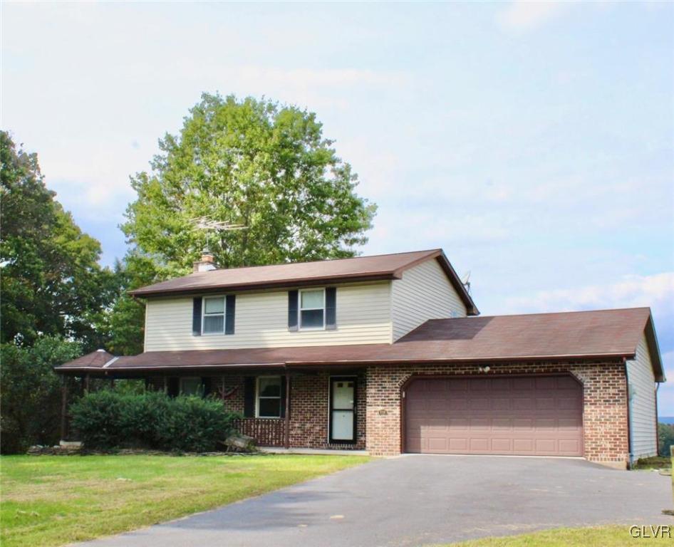 9191 Red Road Kempton, PA 19529 - Photo 3 of 11 a front view of a house with garden