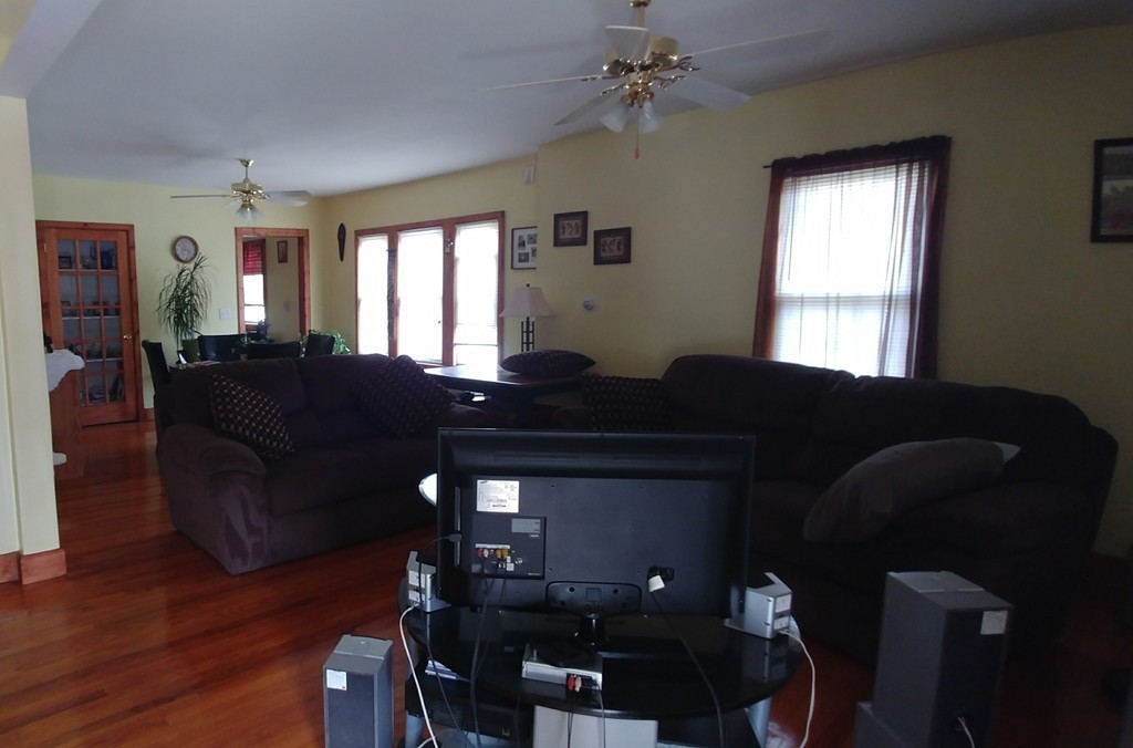 115-117 Malden Street Springfield, MA 01108 - Photo 5 of 9 a living room with furniture and wooden floor