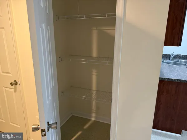 a bathroom with a granite countertop shower and a sink