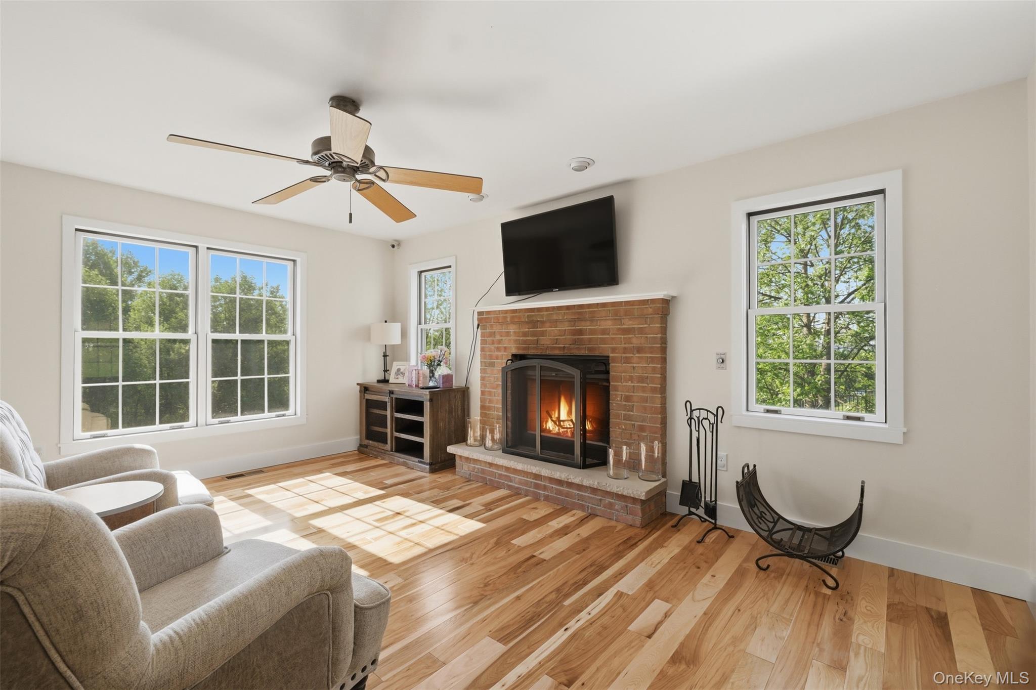 233 Devon Farms Road Stormville, NY 12582 - Photo 11 of 48 a living room with furniture and a fireplace