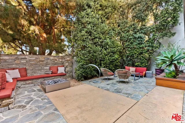 a large white kitchen with a large window