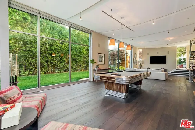 a view of a living room with kitchen