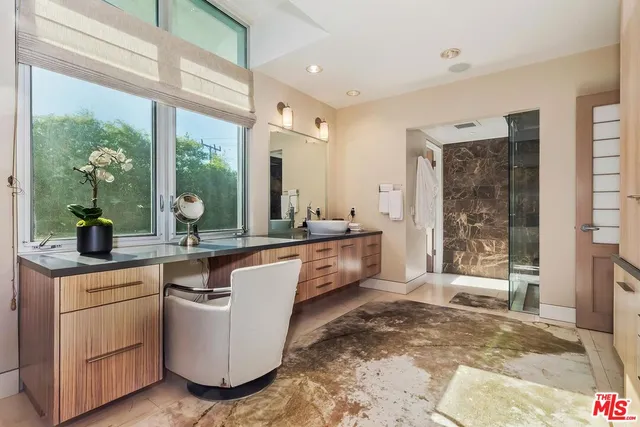 a living room with furniture and large window