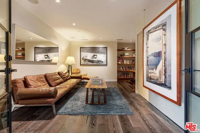 a bathroom with a bathtub a sink and a mirror