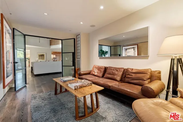 a bedroom with a bed lamp and window