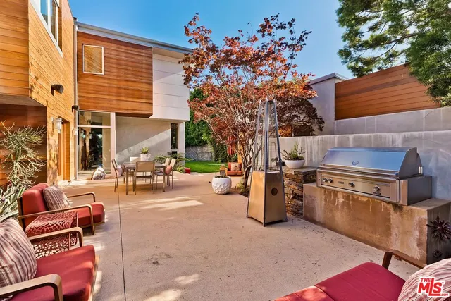 a view of a yard with a large tree